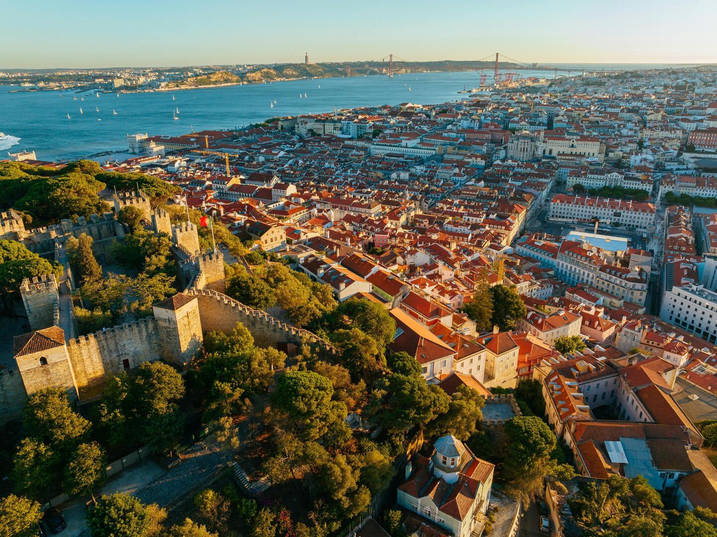 Panoramic view of Lisbon from Castelo de São Jorge showing red rooftops and the Tagus River