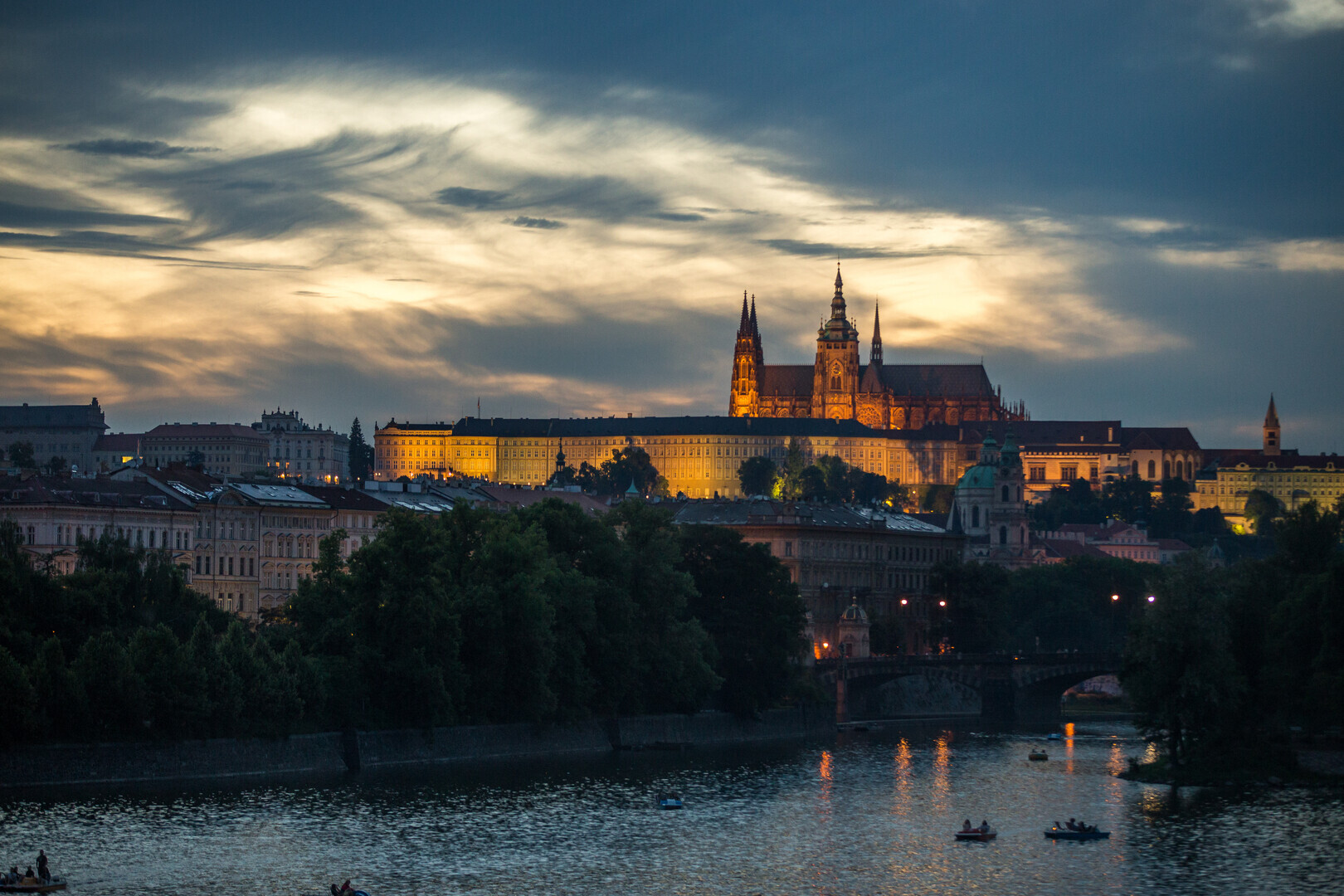 Panoramic view over Prague Castle and the Vltava River at dusk